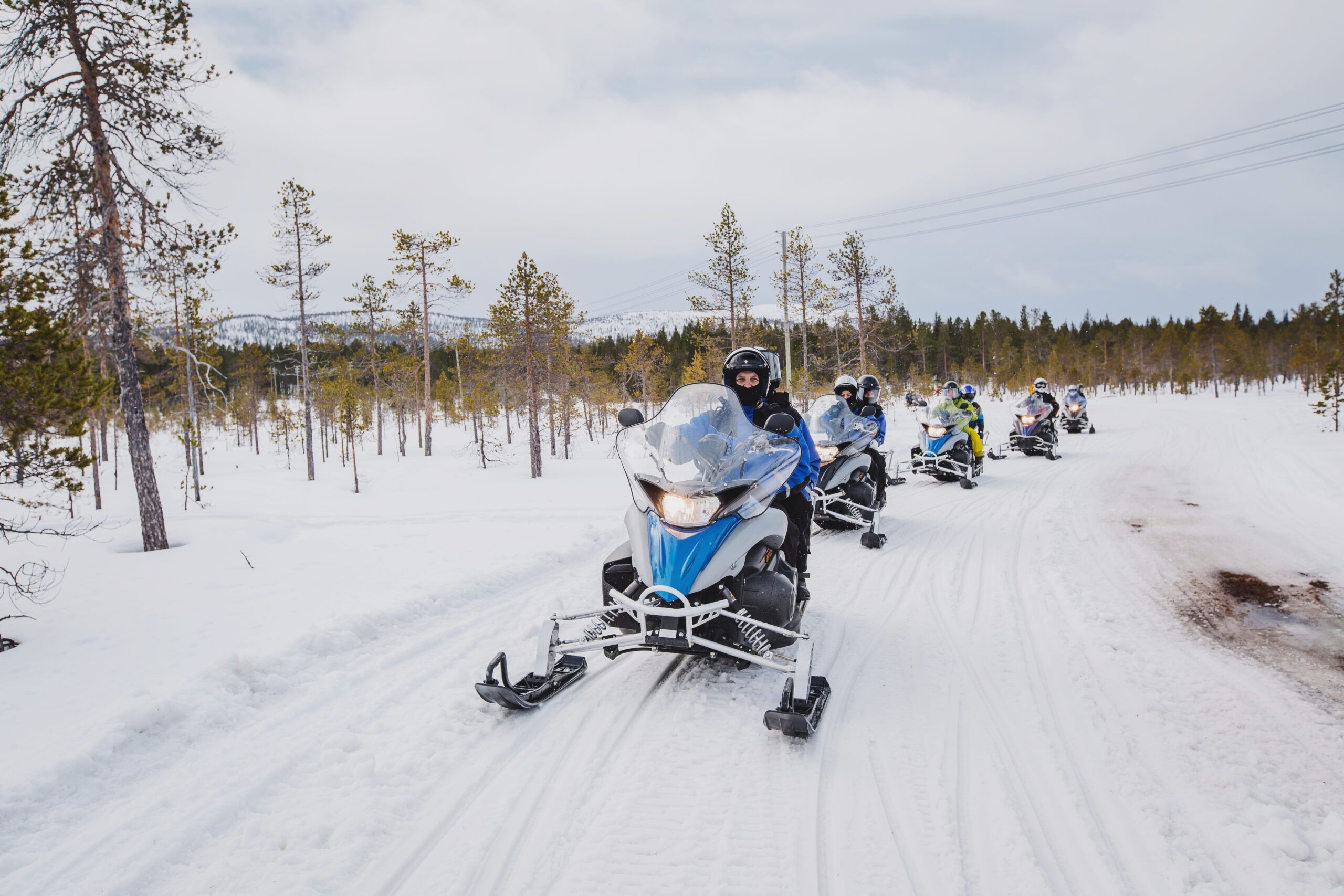 Group,Of,Snowmobiles,On,The,Snow